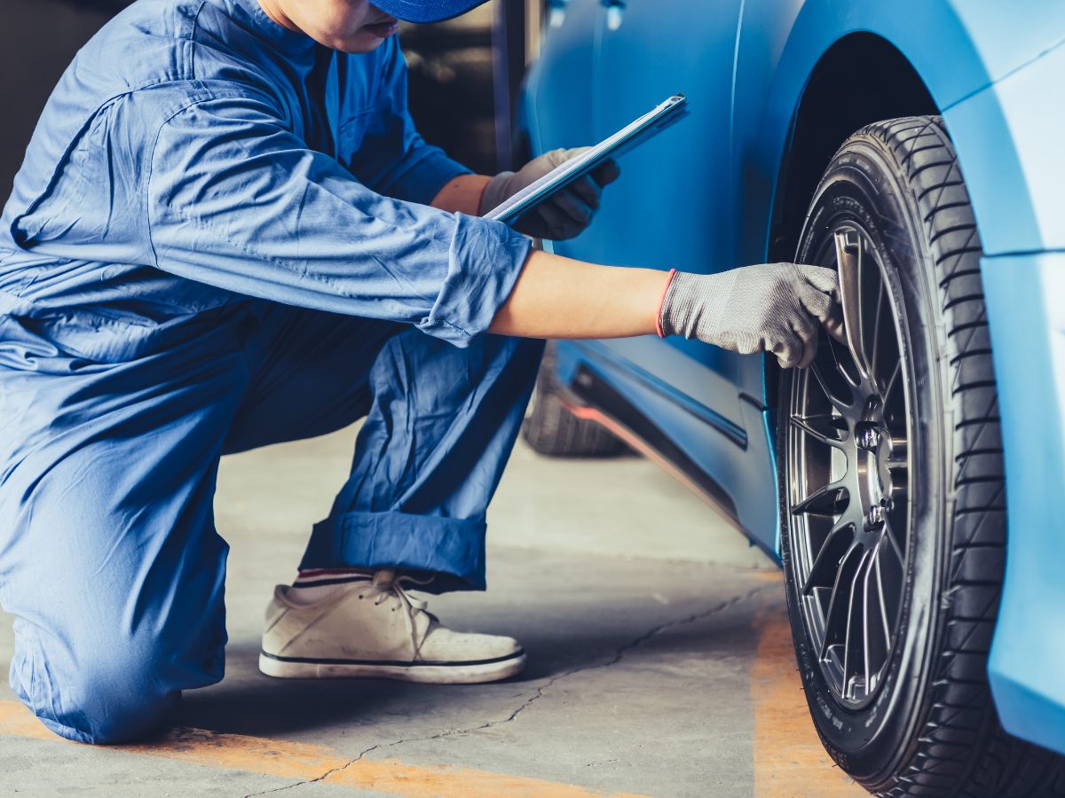 mechanic fixing car tire